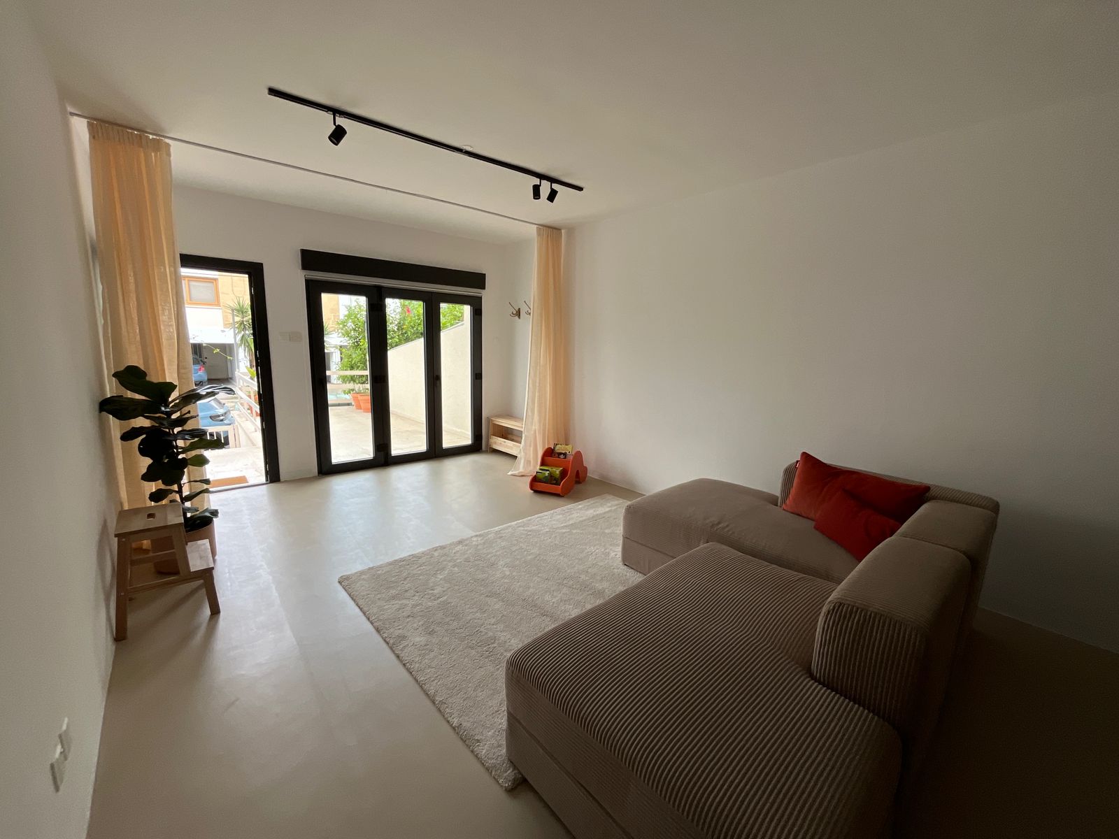 Spacious open-concept layout with comfortable modern pieces